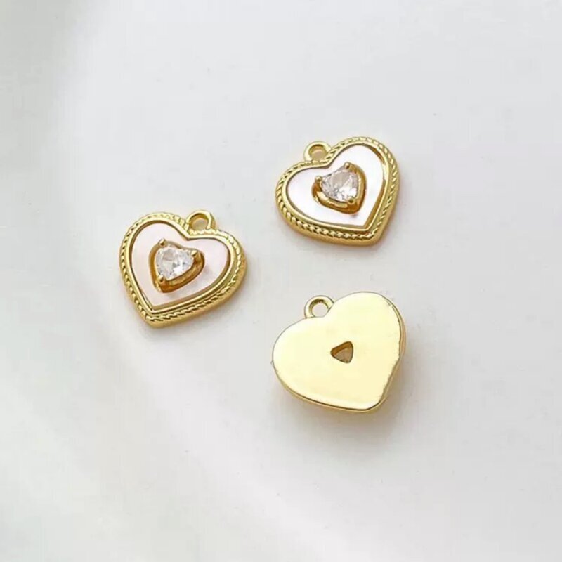 11x11mm 14k aukso sp. nerūdijančio plieno ir kriauklės pakabukas širdis, 1vnt. 11x11mm 14k aukso sp. nerūdijančio plieno ir kriauklės pakabukas širdis, 1vnt.