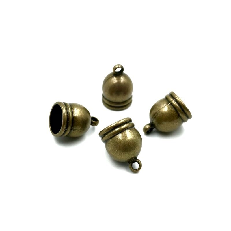 11x16mm žalvario sp. kepurėlės, 7vnt. 11x16mm žalvario sp. kepurėlės, 7vnt.