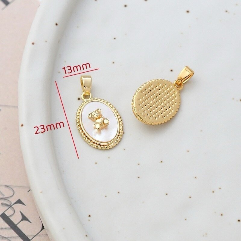 23x14mm 14k aukso sp. nerūdijančio plieno pakabukas su kriaukle, 1vnt. 23x14mm 14k aukso sp. nerūdijančio plieno pakabukas su kriaukle, 1vnt.