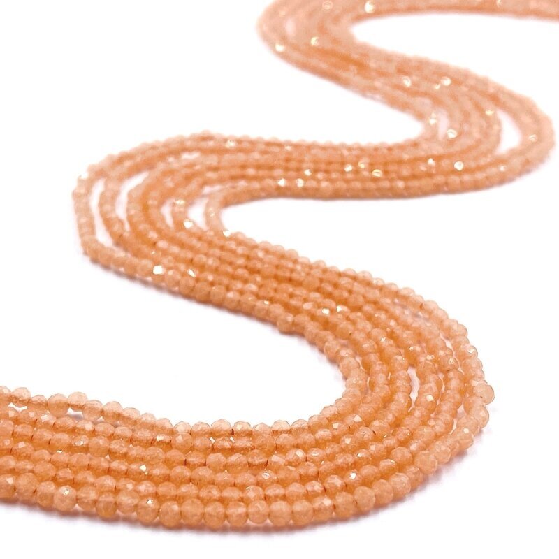 2mm oranžinės sp. facetuota katės akis, ŠVIEČIA TAMSOJE 40cm juosta 2mm oranžinės sp. facetuota katės akis, ŠVIEČIA TAMSOJE 40cm juosta