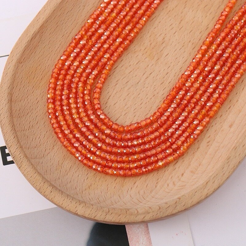 2x3mm oranžinės sp. rondelle formos cirkonio karoliukai, 40cm juosta 2x3mm oranžinės sp. rondelle formos cirkonio karoliukai, 40cm juosta